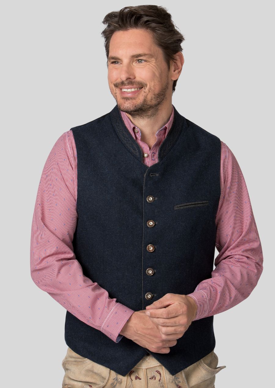 The Trachten vest is more than just an Oktoberfest outfit!  This versatile piece adds a touch of Bavarian flair to any occasion, from festivals and weddings to casual outings.  Pair it with a traditional shirt and lederhosen for a complete look, or dress it down with jeans for a unique everyday style.