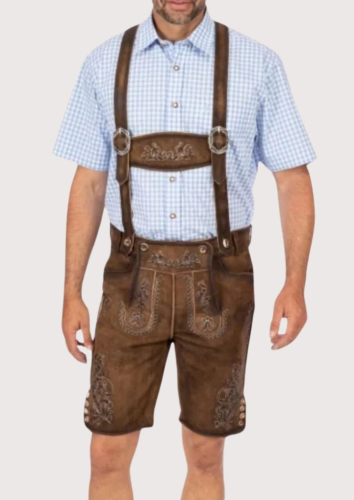 Authentic Bavarian Lederhosen for men, featuring adjustable suspenders, antique buckle, and floral detailing for Oktoberfest and weddings.