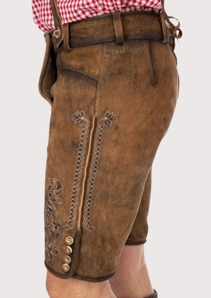 Traditional men's Lederhosen made from durable leather, featuring intricate floral embroidery for a stylish look at any cultural festival.
