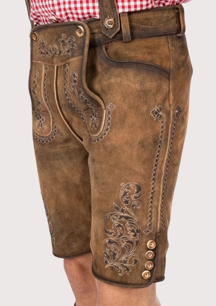 Authentic Bavarian Lederhosen for men, crafted from premium leather with detailed embroidery, perfect for Oktoberfest and cultural events.
