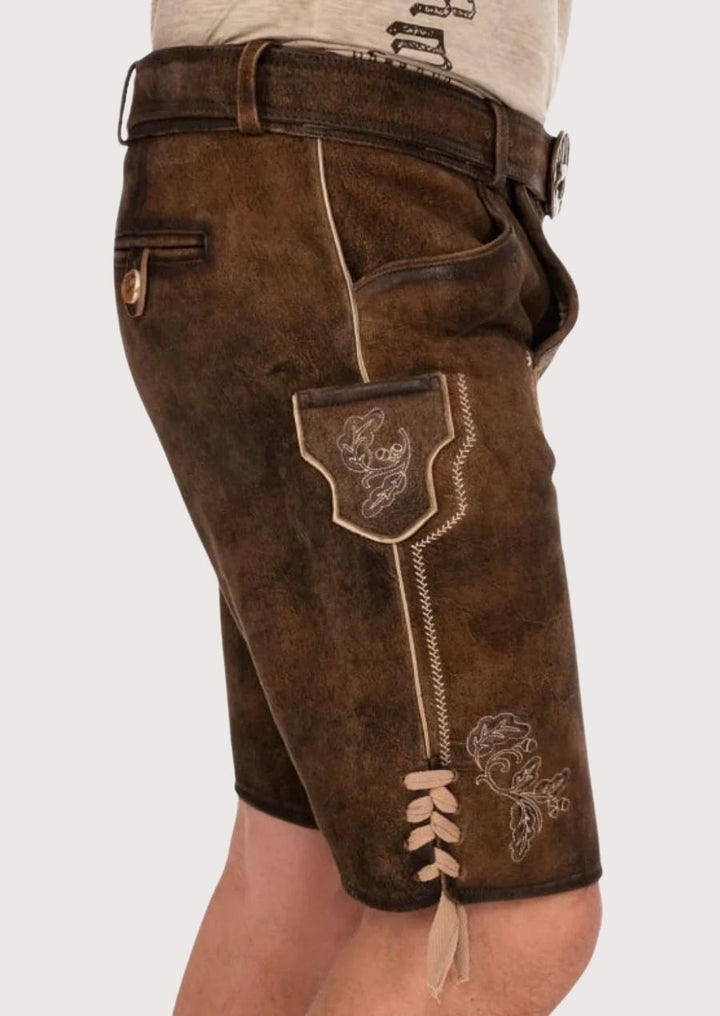 Traditional Bavarian men's costume with embroidery and adjustable side ties