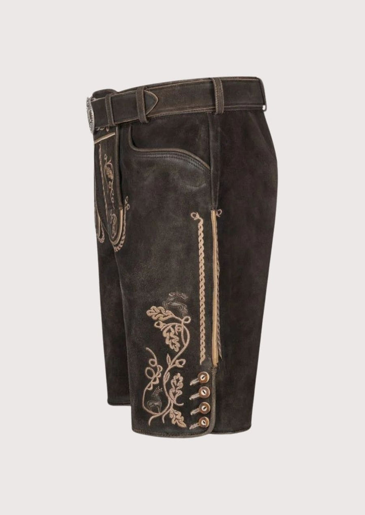 Authentic dark brown suede lederhosen for men with oak leaf embroidery – handcrafted Oktoberfest attire with adjustable belt.