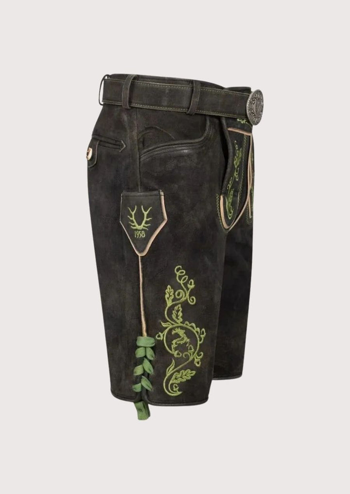 Authentic Bavarian lederhosen for men with custom fit and green embroidered design for Oktoberfest.