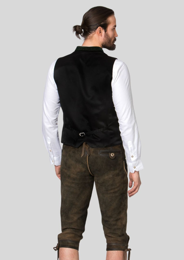 The men's Trachten vest is more than just an Oktoberfest staple.  This versatile piece adds a touch of Bavarian charm to any occasion, from weddings and festivals to casual outings.  The timeless design (mention specific design elements, e.g., classic cuts, muted color palettes)  ensures a sophisticated look, while the comfortable fit (mention specific aspects of fit, e.g., relaxed silhouette, adjustable features)  allows you to move freely and enjoy the festivities.