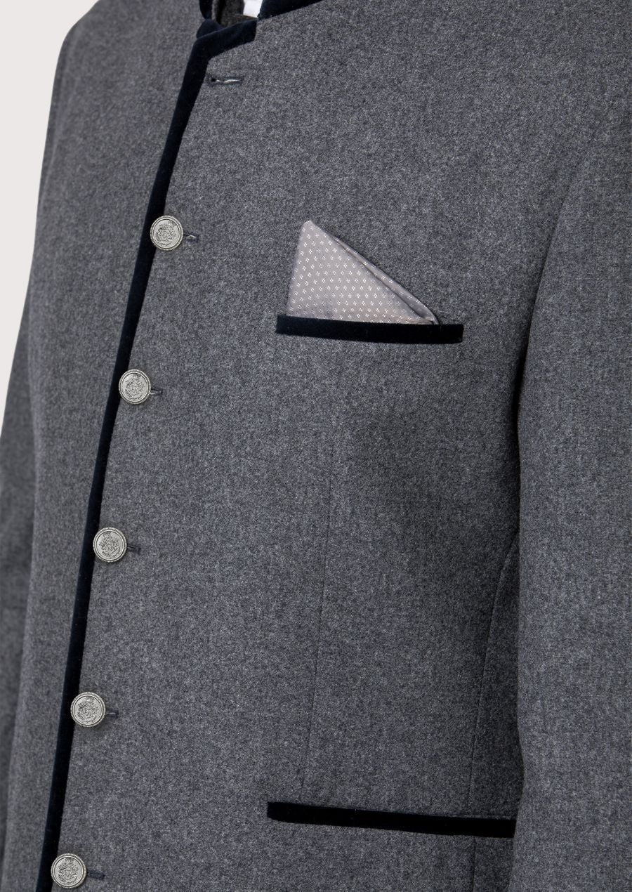  Featuring elegant leather collar and wooden buttons, this jacket blends German tradition with contemporary fashion.