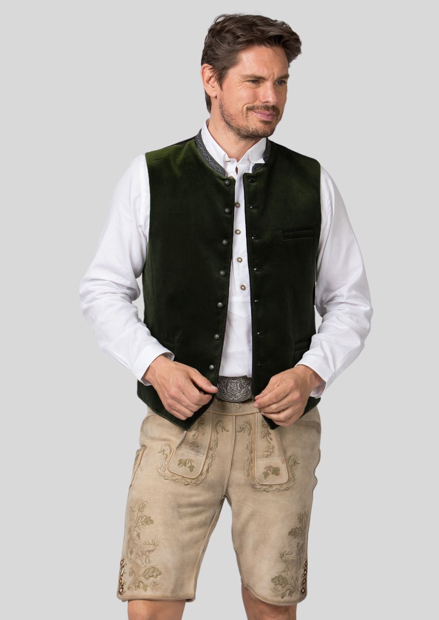 Elevate your formal wear and exude confidence with a Trachten vest.  Traditionally crafted (or mention quality aspects of construction)  from high-quality materials** (mention materials), this vest adds a touch of  **(mention specific design elements, e.g., timeless cuts, unexpected textures)  **that sets you apart from the ordinary.  Celebrate a special occasion in style and turn heads with a touch of unexpected sophistication.