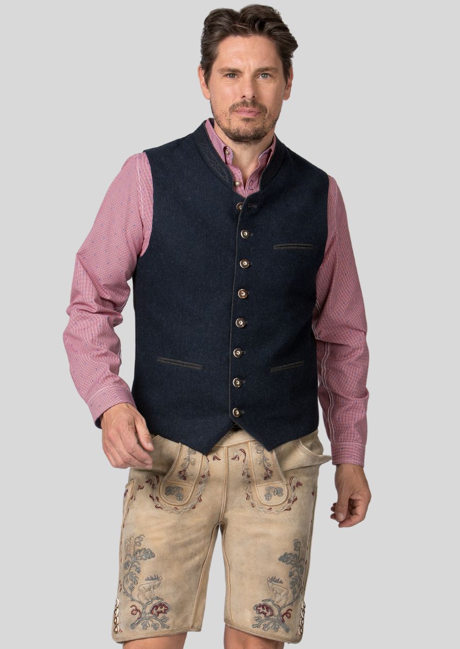 Experience the rich heritage of Bavaria with a men's Trachten vest.  Handcrafted (or mention quality aspects of construction)  from high-quality materials  (mention materials), this vest features  (mention specific traditional design elements, e.g., decorative buttons, rich fabrics)  that pay homage to Bavarian culture.  Add a touch of timeless style to your wardrobe and celebrate tradition in comfort.