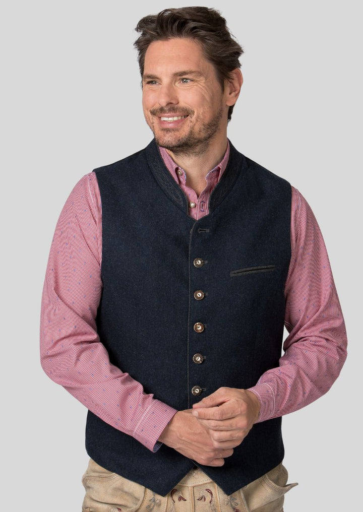 The Trachten vest is more than just an Oktoberfest outfit!  This versatile piece adds a touch of Bavarian flair to any occasion, from festivals and weddings to casual outings.  Pair it with a traditional shirt and lederhosen for a complete look, or dress it down with jeans for a unique everyday style.