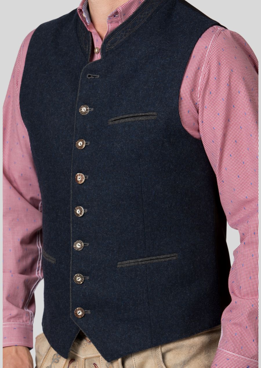 Owning a Trachten vest is more than wearing clothing; it's connecting to a legacy.  Skilled artisans (mention their origin or heritage if relevant)  have poured their passion into creating this authentic piece.  Celebrate tradition in style and own a vest that embodies the spirit of Bavaria.