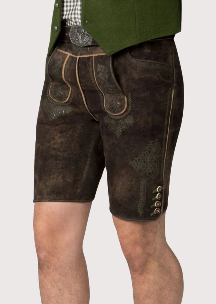 Dark brown Bavarian lederhosen with traditional embroidery, authentic German leather shorts for Oktoberfest and Alpine festivals.