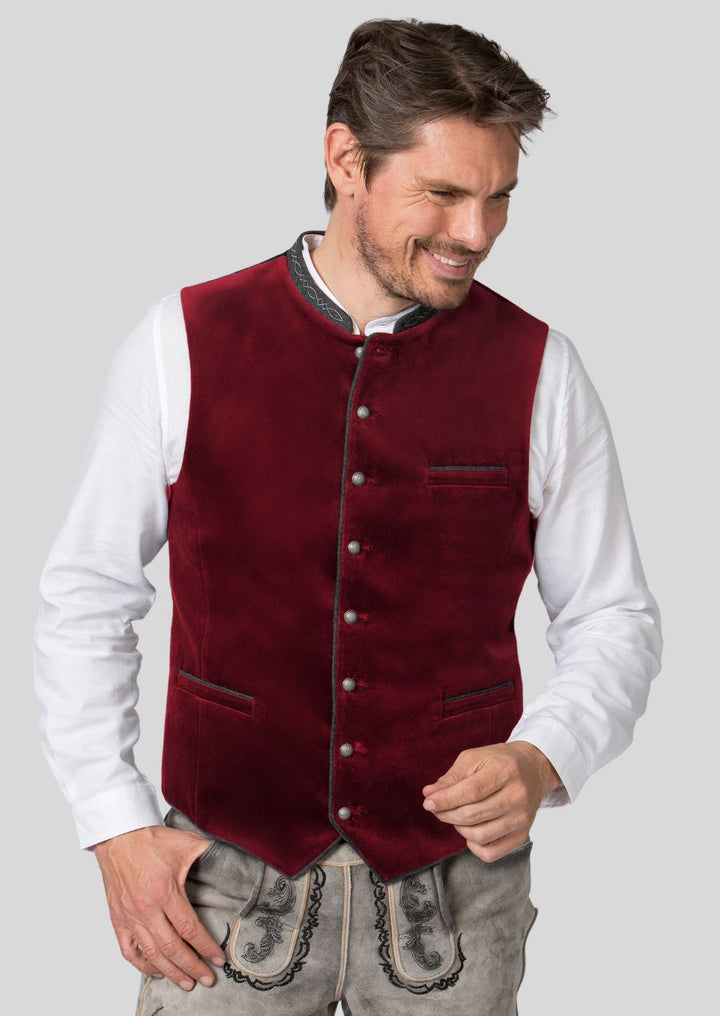 Look and feel your best in a Trachten vest that perfectly complements your style!  We offer a variety of sizes and styles to ensure you find the perfect fit.  From classic cuts to modern designs, and a wide range of colors and patterns, our Trachten vests are perfect for any occasion.  Elevate your festival look, add a touch of Bavarian flair to a wedding outfit, or dress it down for a casual day out.  Celebrate in style and comfort with a Trachten vest that is uniquely you.