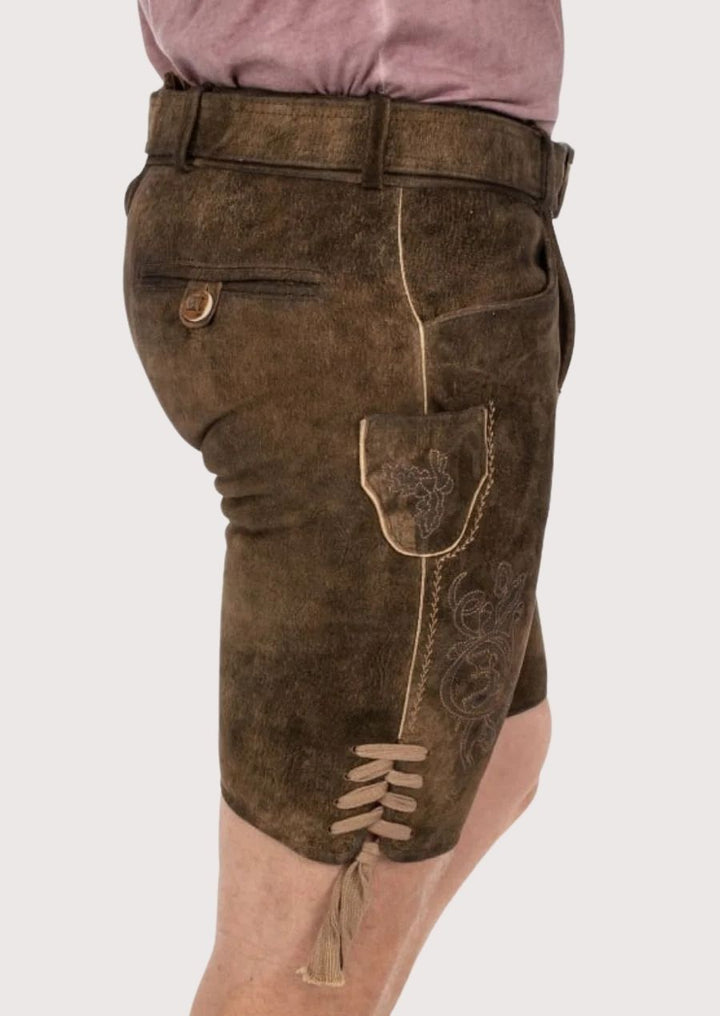 Classic German-style Lederhosen in rich brown leather with belt and embroidery for traditional folk events.