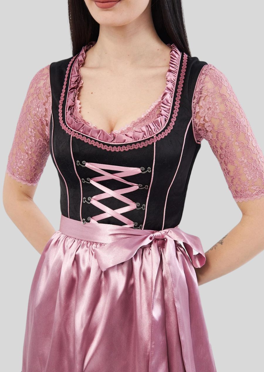 Crafted from the finest materials, such as delicate silk or luxurious velvet, our dirndl offers unparalleled comfort and elegance.