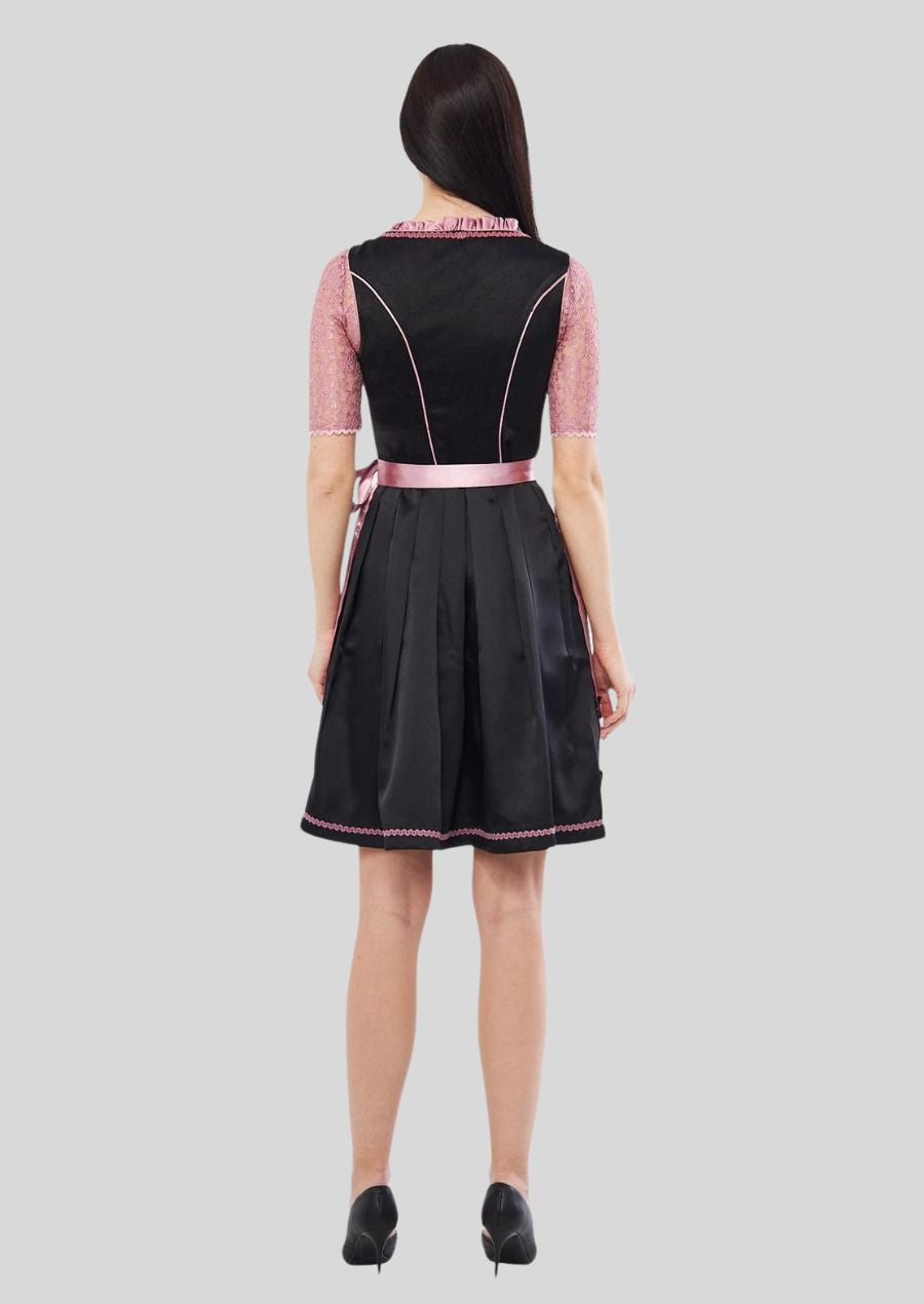  The classic dirndl silhouette combined with exquisite hand-stitching creates a timeless piece that transcends trends.