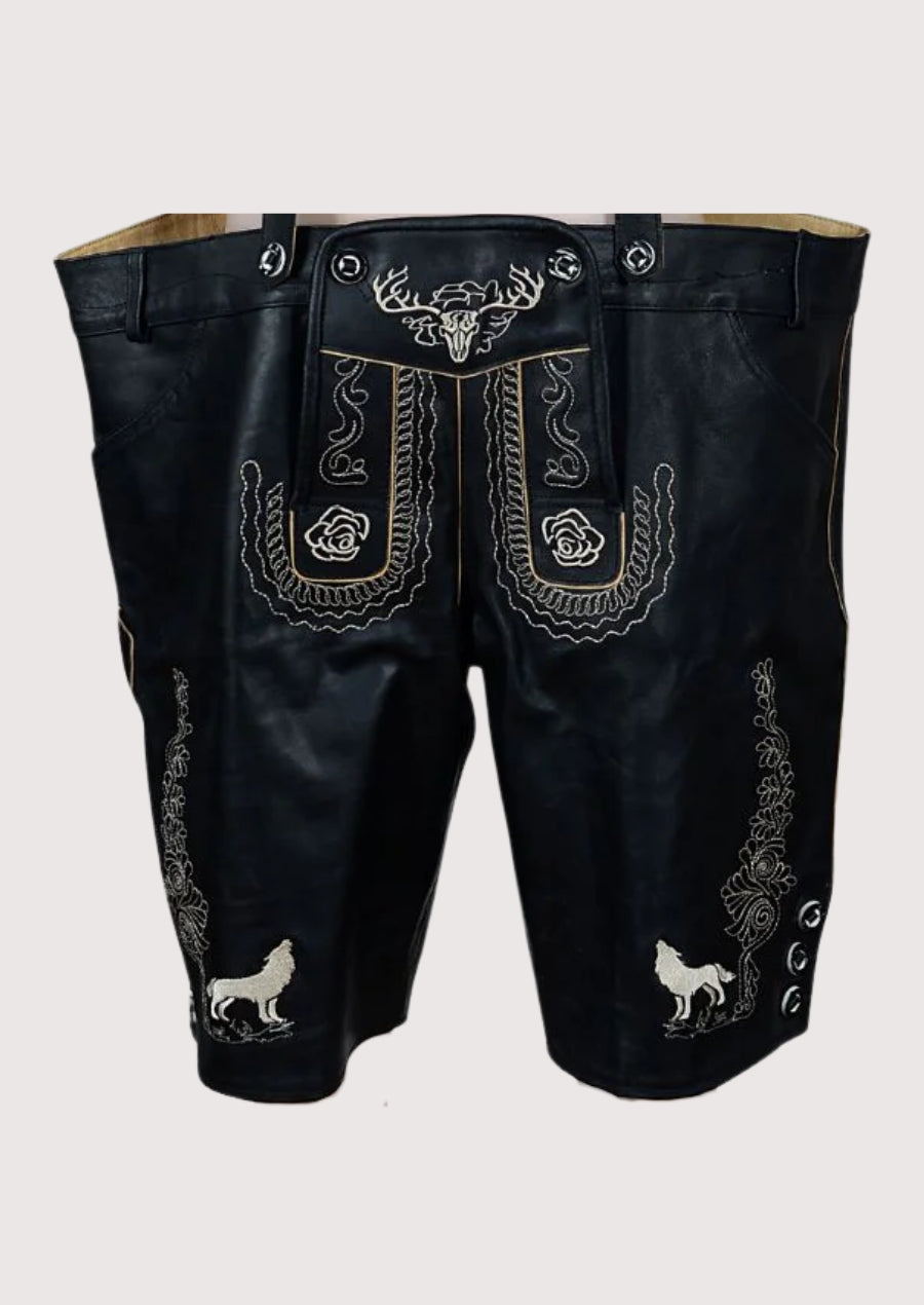 Black leather pants with white embroidery and animal designs on a light gray background