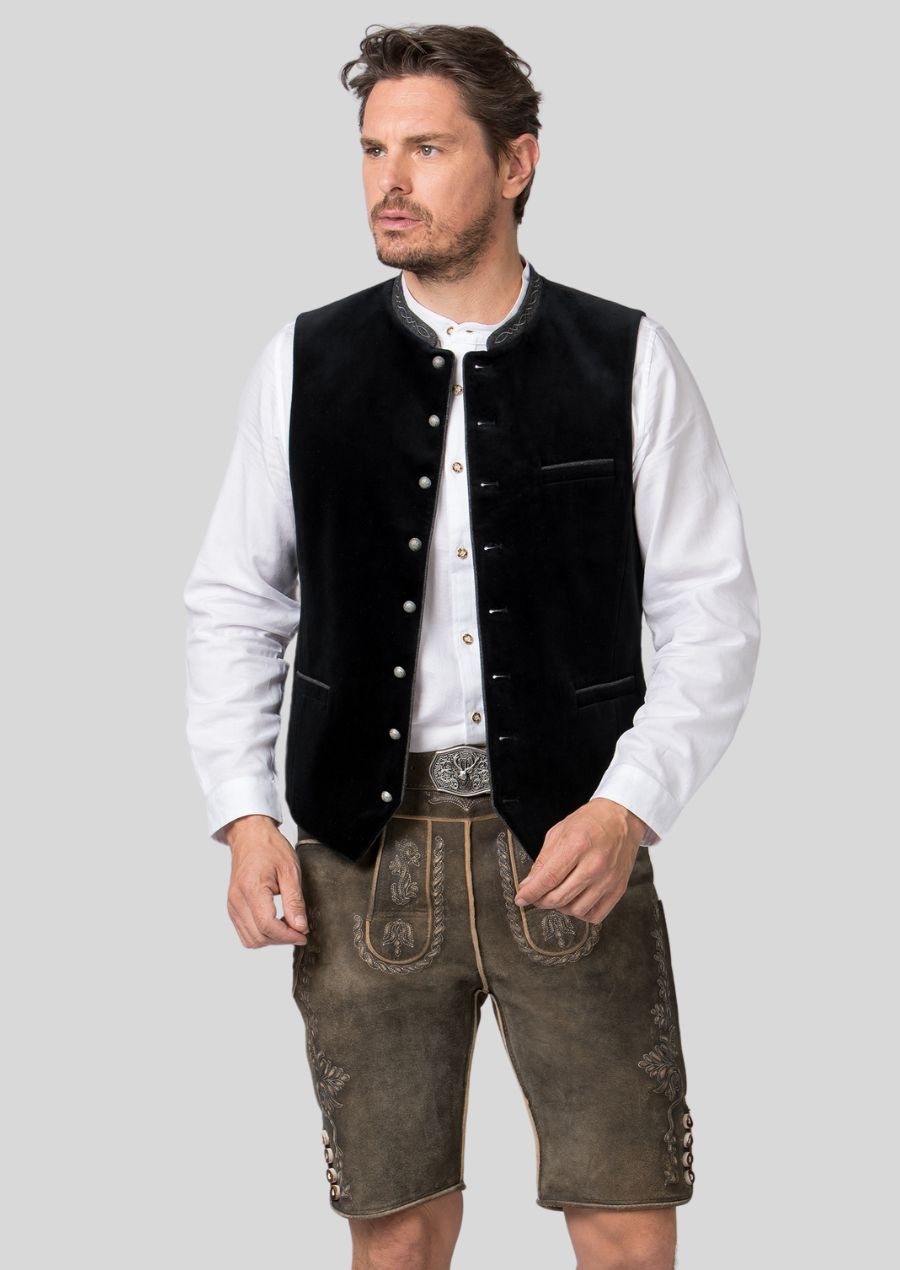 Elevate your Oktoberfest outfit with a men's Trachten vest.  Crafted from premium materials (mention specific materials, e.g., loden cloth, wool), this vest boasts  **(mention classic design elements, e.g., rich colors, decorative buttons)  that embody Bavarian tradition.  The sharp silhouette (mention specific aspects of the cut, e.g., tailored fit)  flatters your figure and ensures you look your best as you celebrate Oktoberfest in style.