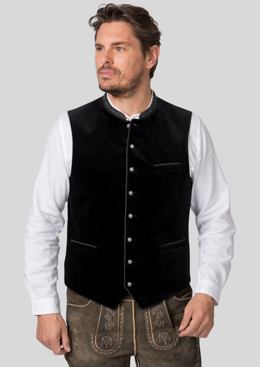 Take your Oktoberfest look to the next level with a Trachten vest.  This versatile piece  (mention how it elevates a simple outfit, e.g., adds a touch of sophistication to a lederhosen and shirt combination)  transforms you from an ordinary attendee to a man of refined taste.  Embrace the festive spirit and look sharp while celebrating Oktoberfest.