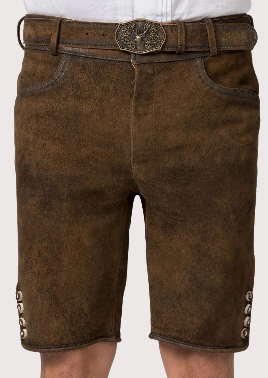 Traditional German men’s lederhosen with rustic suede texture and classic stag buckle

