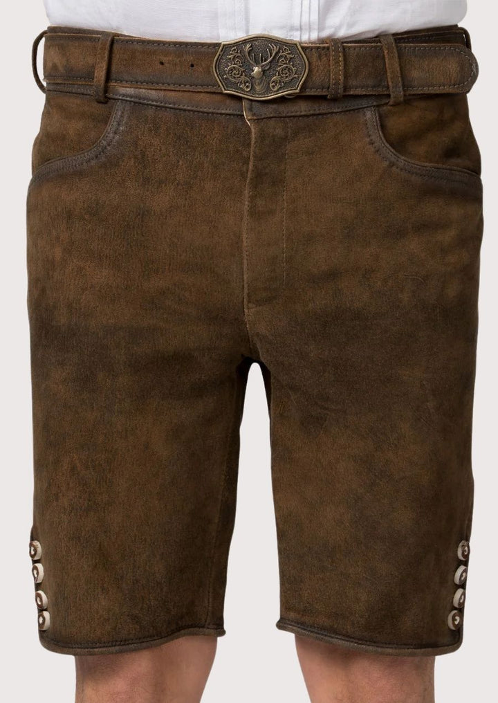 Traditional German men’s lederhosen with rustic suede texture and classic stag buckle

