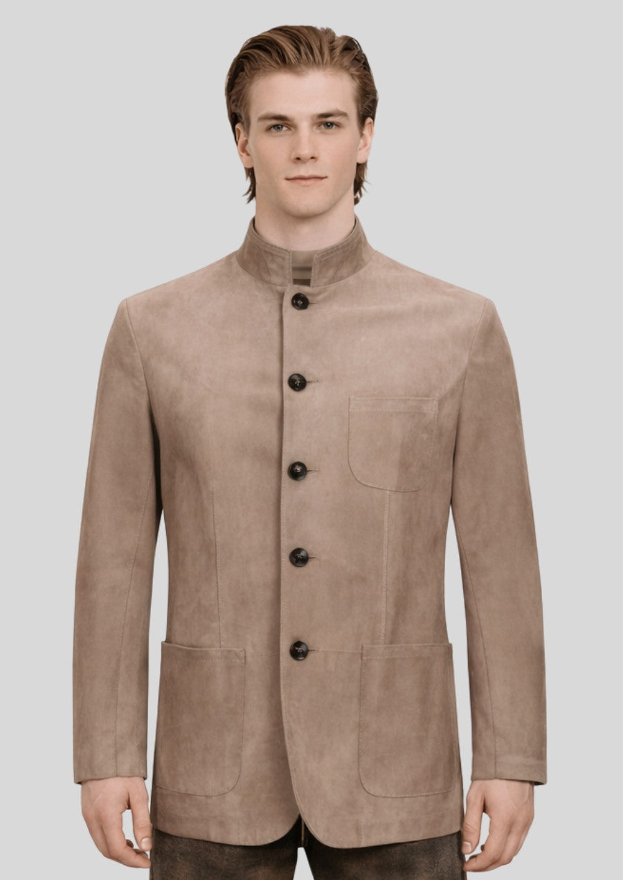 Male model wearing a beige Bavarian trachten jacket with stand collar, suede texture, and classic tailoring.