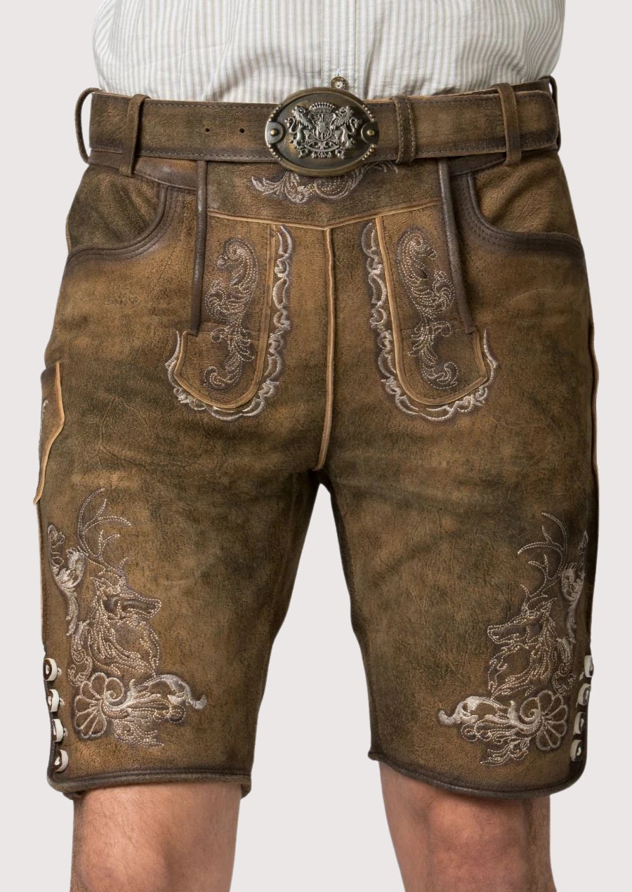 Men’s brown leather lederhosen featuring traditional Bavarian embroidery, front pockets, and decorative belt buckle.