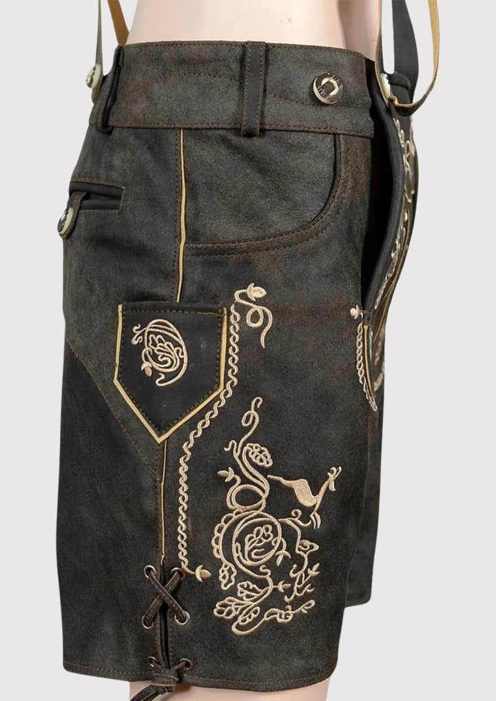 Traditional dark Bavarian lederhosen with suspenders, ornate embroidery, durable leather material, and Oktoberfest festival attire.