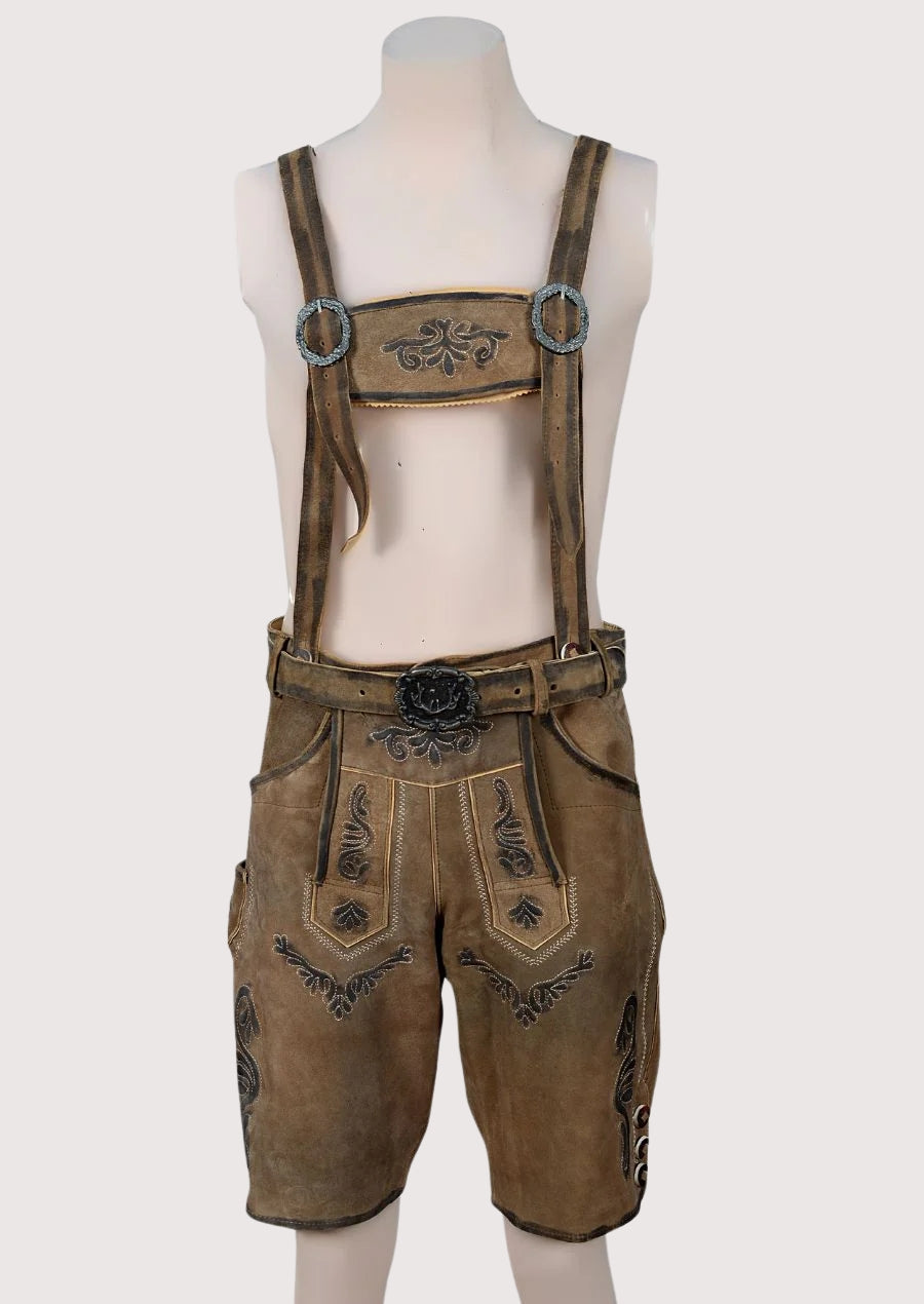 Rustic men’s leather lederhosen with suspenders, detailed embroidery, and traditional Bavarian Alpine styling.