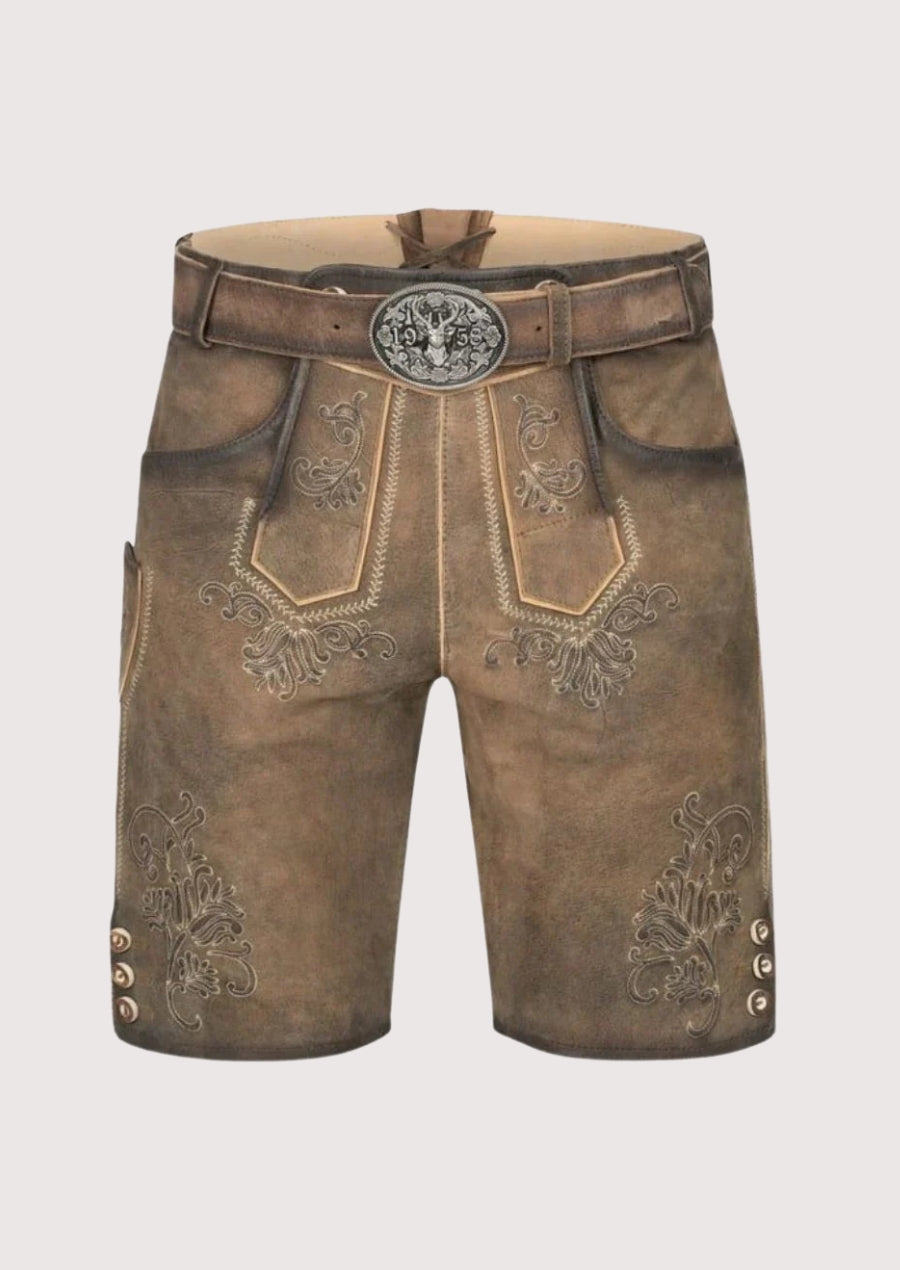 Brown leather shorts with decorative patterns and a belt on a light gray background