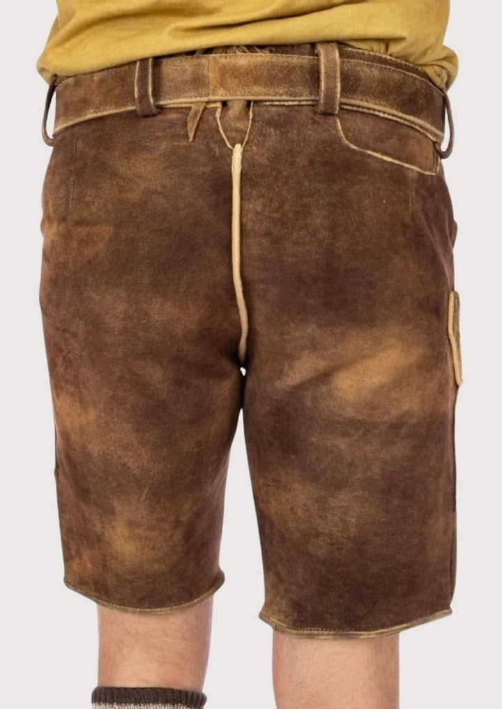 Stylish men's Lederhosen with intricate green embroidery, made from soft leather, perfect for Oktoberfest and cultural festivities.