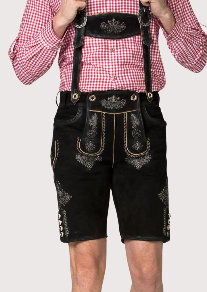Stylish men's Lederhosen with durable black leather and silver embroidery, perfect for Bavarian cultural events.