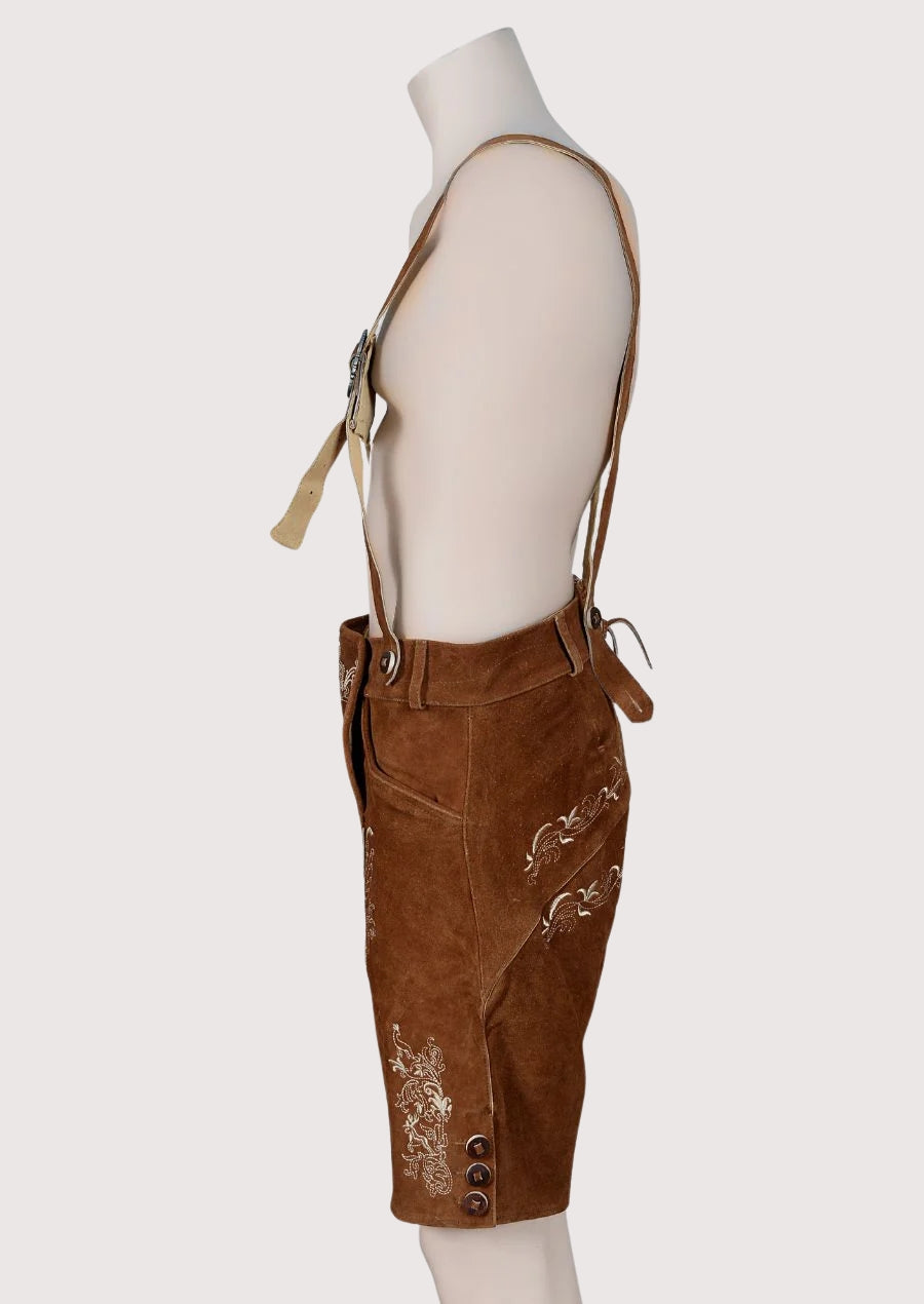 Authentic Bavarian brown lederhosen featuring detailed embroidery and suspenders, ideal German festival and Oktoberfest attire.