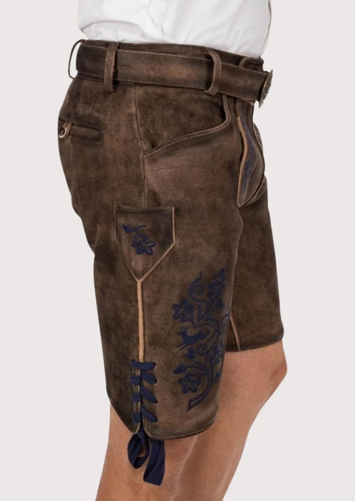 Authentic Bavarian men's Lederhosen with durable leather and intricate blue floral embroidery for festivals.