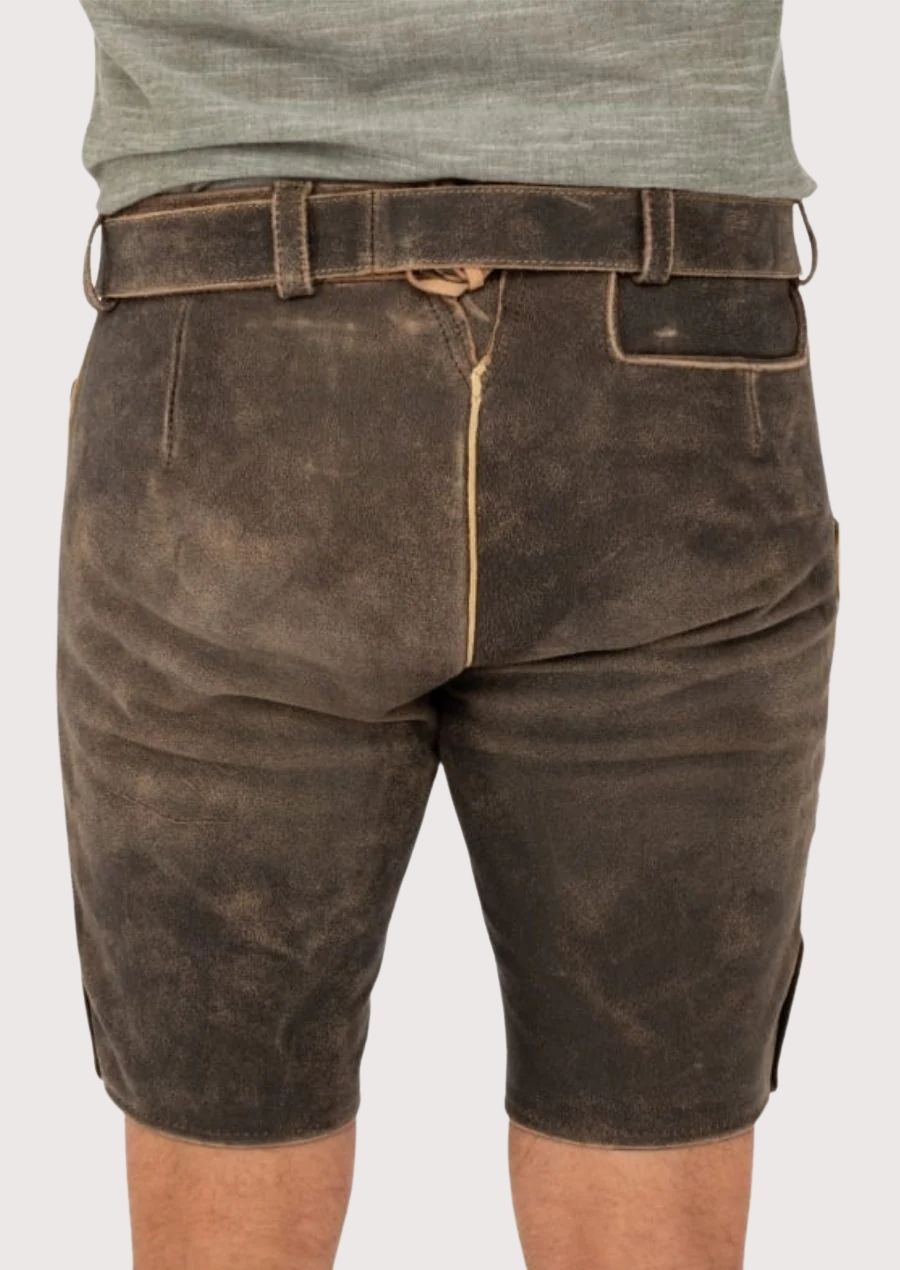 Men’s lederhosen featuring gold embroidery and durable leather, perfect for traditional festivals like Oktoberfest.