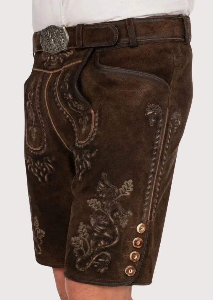 Authentic Bavarian Lederhosen for men with a deep brown color and traditional embroidery – ideal for festivals.