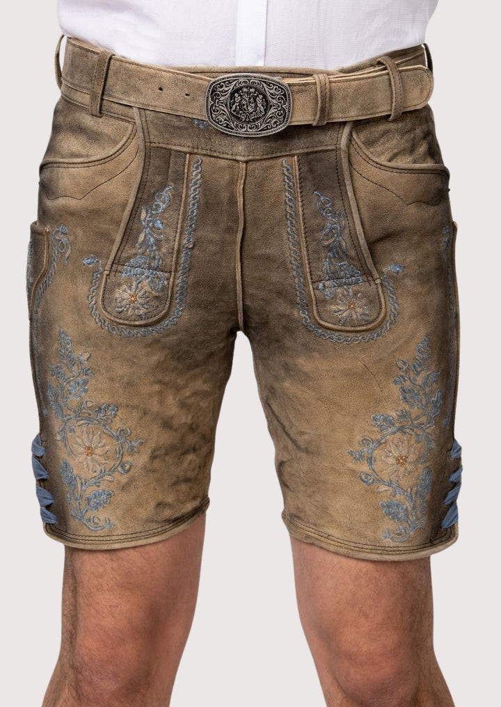 Tan lederhosen shorts with blue Bavarian embroidery detail