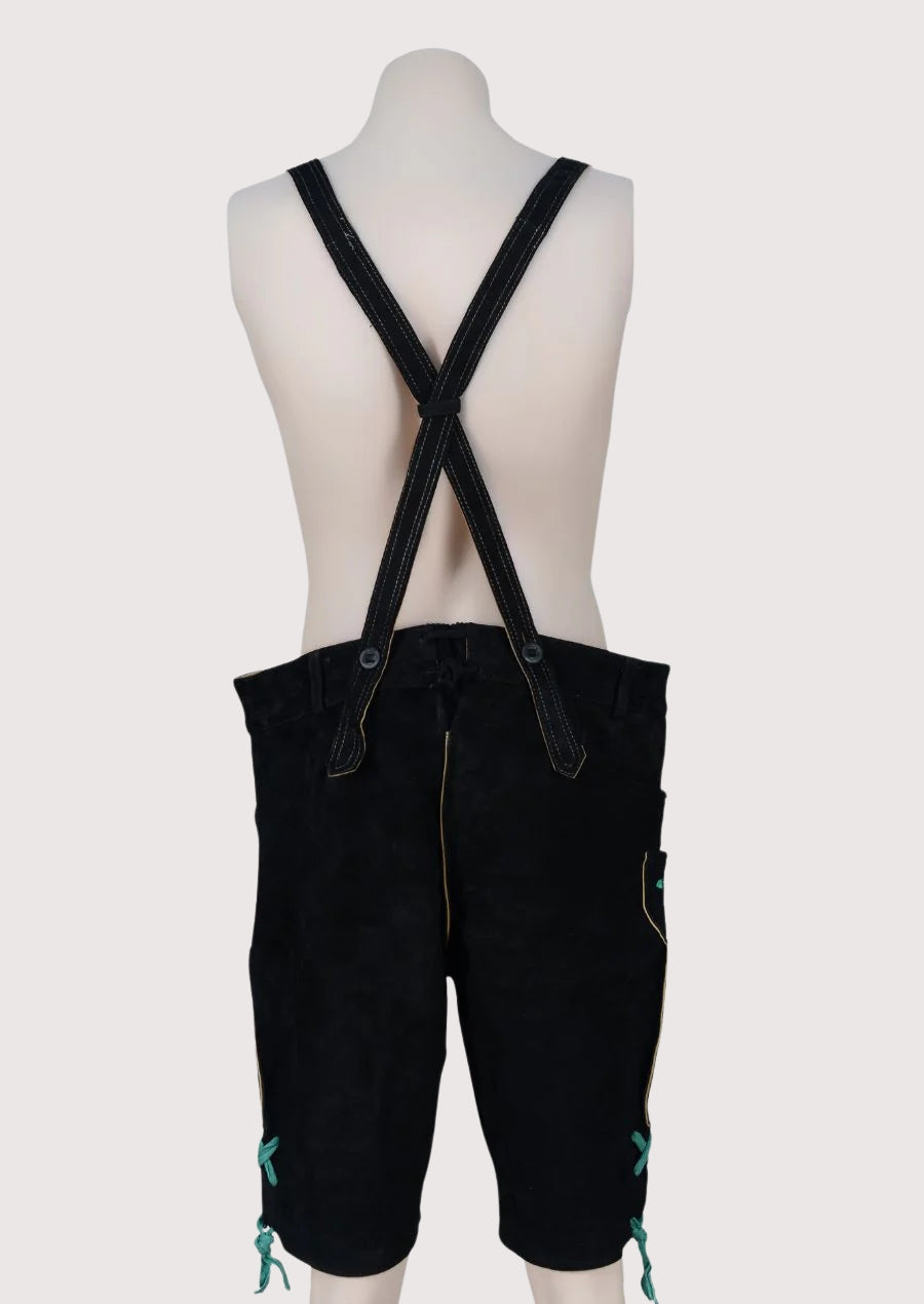 Traditional black lederhosen featuring green stitched alpine decorative patterns