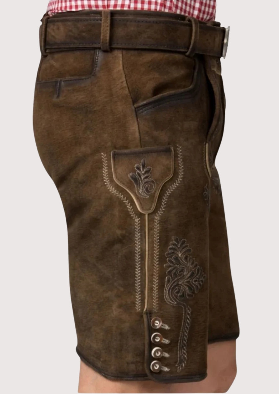 Vintage brown lederhosen shorts designed for Oktoberfest with authentic embroidery and rustic leather finish